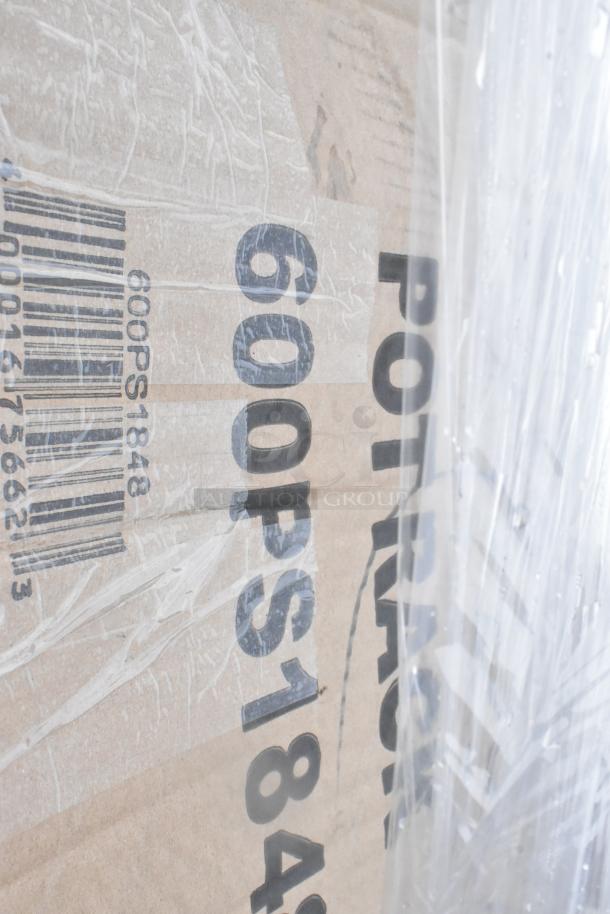 Cardboard box labeled "600PS1848" and barcode, indicating new scratch and dent items including shelving and tabletop.