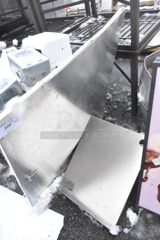 Metal panels with a reflective surface, minor scratches, and a visible label. Auction tag reads "320."