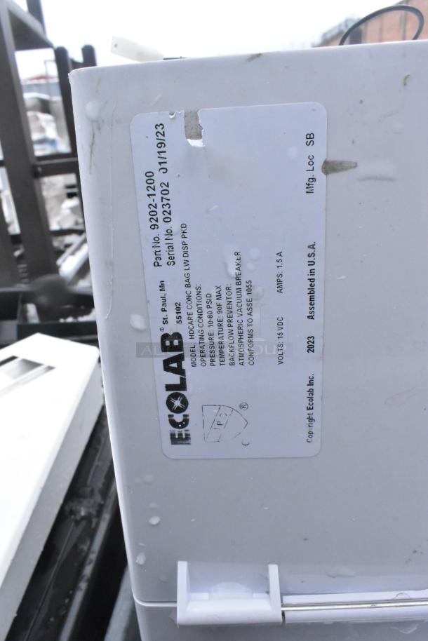 Ecolab water booster with model and serial number labels visible, in used condition with some wear.