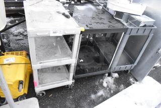3 Poly 2-tier utility carts on commercial casters, showing signs of wear, labeled "322" and "323" for auction lot identification.