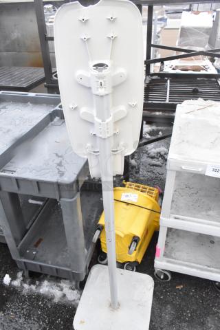 Yellow mop bucket with wheels and white caution sign. Items show wear, on sale for double bid.