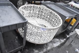 Ornate white metal bin with floral cutout design, showing some wear. Auction tag marked "325."