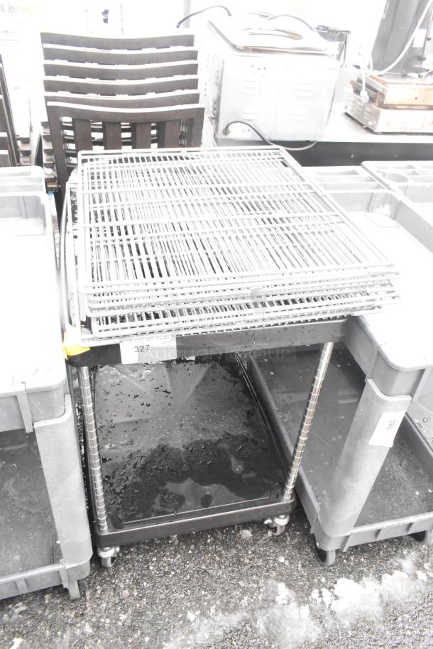 Black 2-tier cart on commercial casters with wire racks included, showing label "327 Qty 1". Used condition.