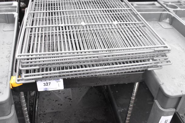 Black 2-tier cart with commercial casters, includes wire racks. Appears in good condition, labeled as item 327.