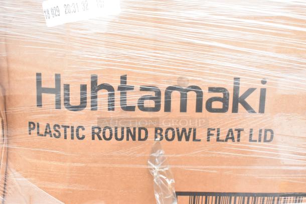 Huhtamaki Plastic Round Bowl Flat Lid box wrapped in plastic. Clear branding and labeling visible. Part of auction lot.