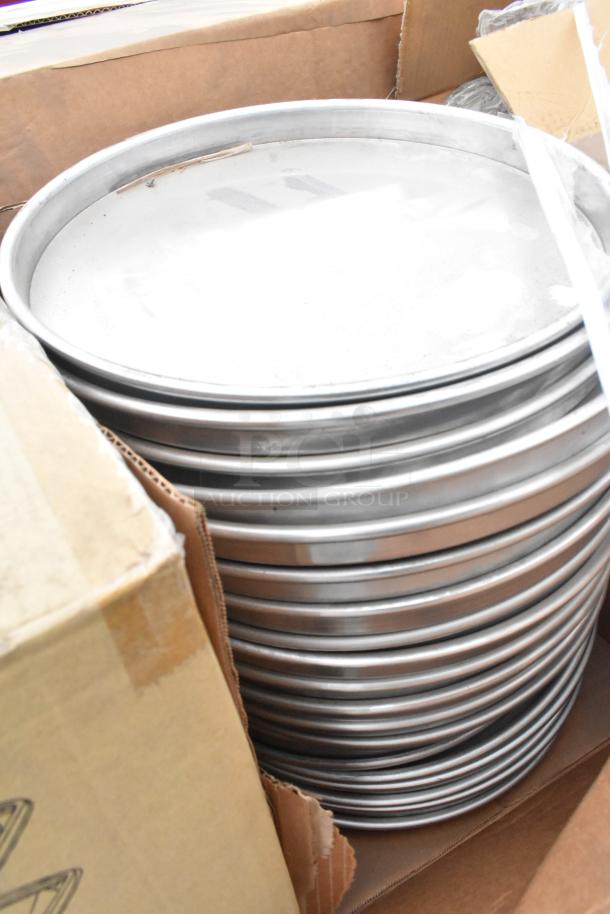 Stacked metal round pans in original packaging, part of a lot of 19 new "scratch and dent" items including Allied and Sabert brands.