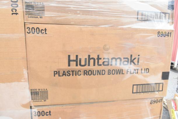 Boxes of Huhtamaki 89041 Plastic Round Bowl Flat Lid, 300 count, Made in USA, visible label and barcode.