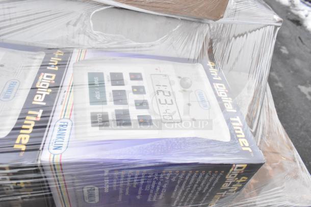 Stack of Franklin 4-in-1 Digital Timers in boxes, sealed in plastic wrap. Mint condition, clearly displays timer controls.