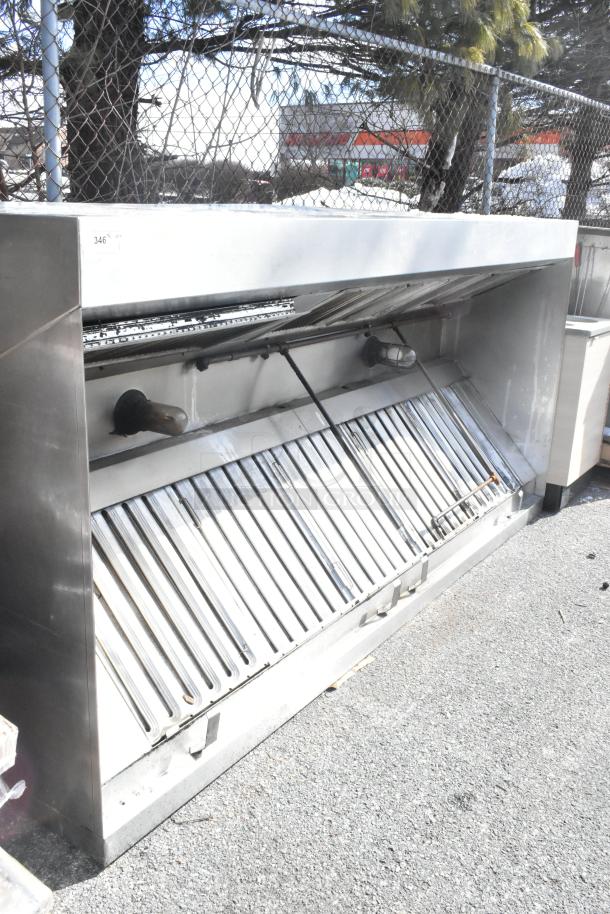 9.5' commercial return air grease hood with filters and lids, stainless steel, outdoor setting, good condition.