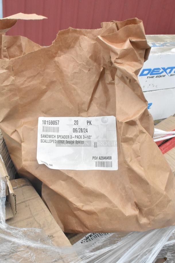 Brown paper bag labeled "Sandwich Spreader 3-Pack 3-1/2" Scalloped Edge," part of a new scratch and dent auction lot.