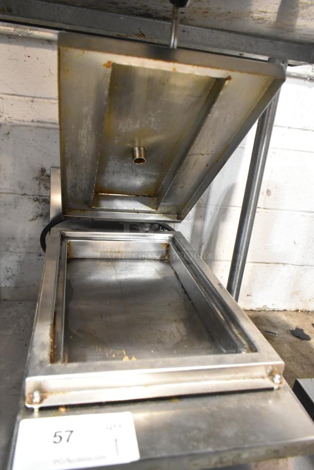 Commercial countertop electric steamer, 208 volts, 1 phase, stainless steel, visible wear, open lid showing interior.