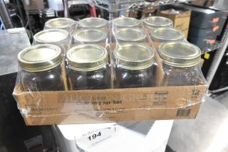 Box of 12 Mainstays 1-pint canning jars, new, scratch and dent condition. Includes lids and rings. Packaged in brown box.