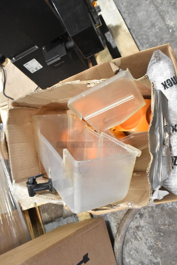 Brand new Zumex 08577 Speed Up juicer with 40 fruits/minute capacity, shown with box of parts. Scratch and dent condition.