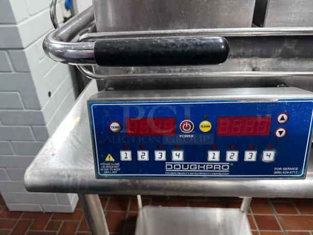 DoughPro double-sided commercial contact grill, immaculate condition, digital controls visible, NSF & UL listed, 115V.