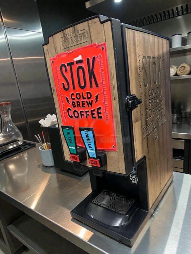 STōK Cold Brew Coffee Dispenser by Creamiser, Model 230. Excellent condition, 110V, single phase. Features Black and Vanilla taps.