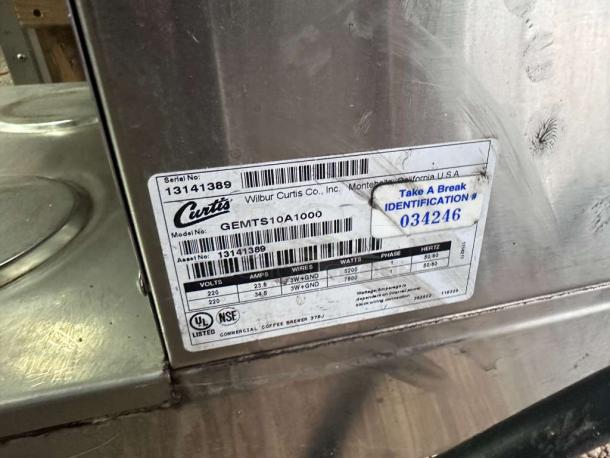 Wilbur Curtis GEMTS10A1000 Gemini Twin coffee brewer label, showing model, serial number 13141389, 220V, UL & NSF listed.