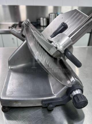 Hobart Commercial Manual Meat Slicer, NSF Listed, fully operational, made in USA, features precision dial and robust build.