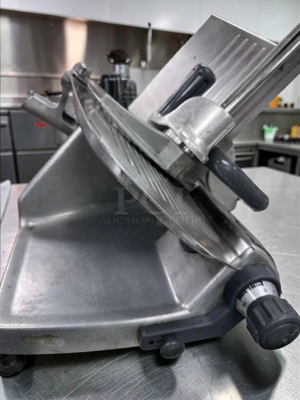 Hobart commercial manual meat slicer, NSF listed, fully tested, operational, stainless steel, adjustable thickness dial. Made in USA.