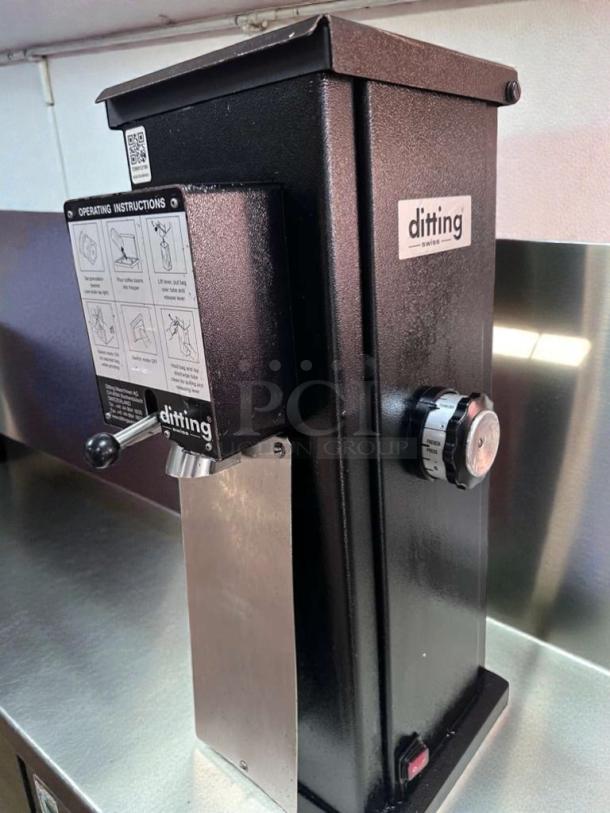 Ditting KR1203 commercial coffee grinder, excellent condition, Swiss-made, 120V, ETL listed, fully operational, instruction label visible.