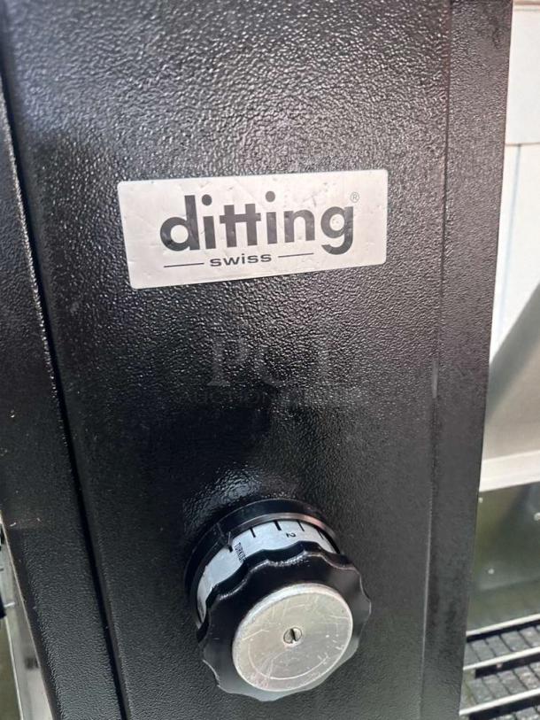 Ditting KR1203 coffee grinder, black casing, Swiss-made, excellent condition, visible logo "ditting Swiss", ETL Listed.