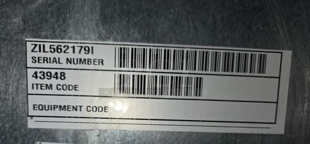 Label on the Lancer FS30 dispenser showing serial number ZIL562179I and item code 43948.