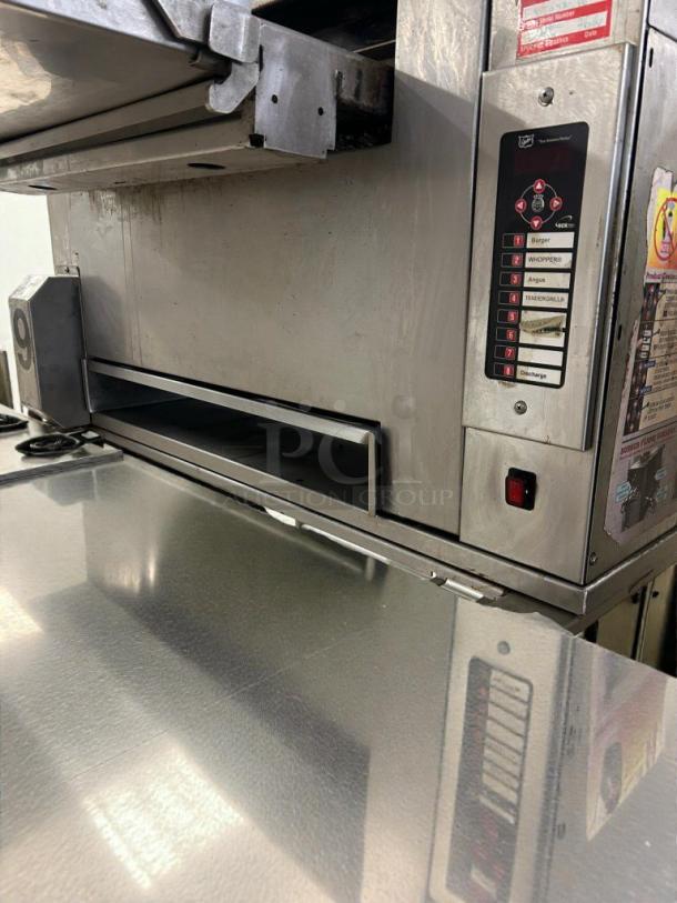 Alt text: Duke Electric Conveyor Broiler Oven in immaculate condition, showcasing controls and stainless steel surface, model DUK-L-BROIL-0527.