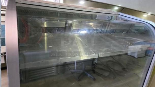 The C. Schmidt EHD-4 refrigerated deli display case with curved glass, in impeccable condition, fully operational.