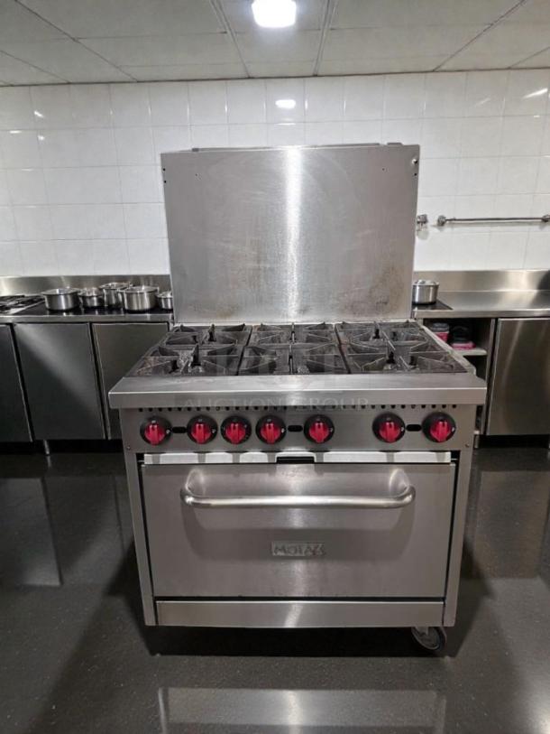 Montague 6-burner commercial gas range with oven, natural gas, NSF listed, fully tested, operational, model MON-L-GAS-0542.