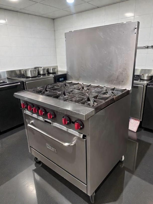Montague 6-burner commercial gas range with oven, natural gas, NSF listed, fully operational, stainless steel, model MON-L-GAS-0542.