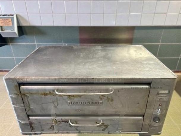 Blodgett double deck commercial pizza oven, gas, heavy-duty stainless steel, visible wear, fully tested and operational.