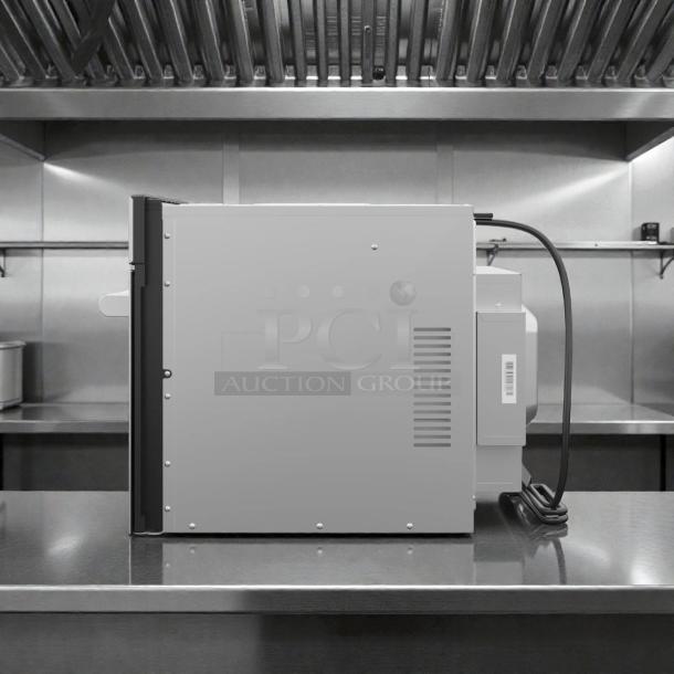 KoolMore KM-CWO24-SS stainless steel convection oven, brand new, pristine condition, side view, 120V, model tag visible.