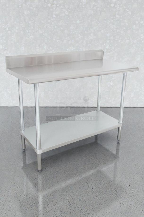 Brand new Advance Tabco stainless steel work table, Model KLAG-304-X. Scratch & Dent condition. Durable, with undershelf.