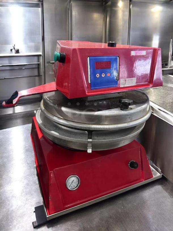 Red electric dough press by Commercial Foodservice Equipment, model DOU-L-PRS-0384, in excellent condition with digital controls.