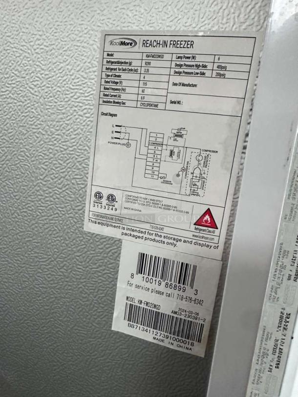 KoolMore KM-FHD20MGD label showing UL and NSF listings, model details, and operational specifications on a commercial freezer.