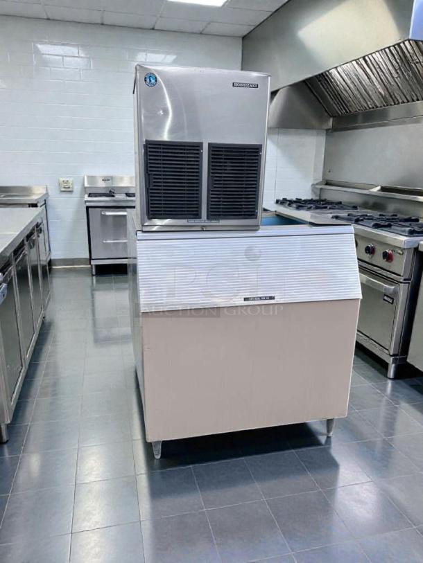 Hoshizaki E-1001MAH commercial ice maker in excellent condition with storage bin, air-cooled, UL & NSF listed, in a kitchen setting.