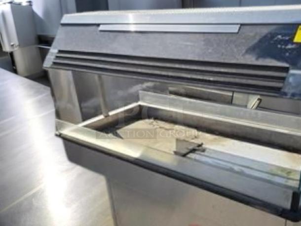 Duke E304 4-well electric steam table with sneeze guard, in very good condition, 208V, fully tested, made in USA.