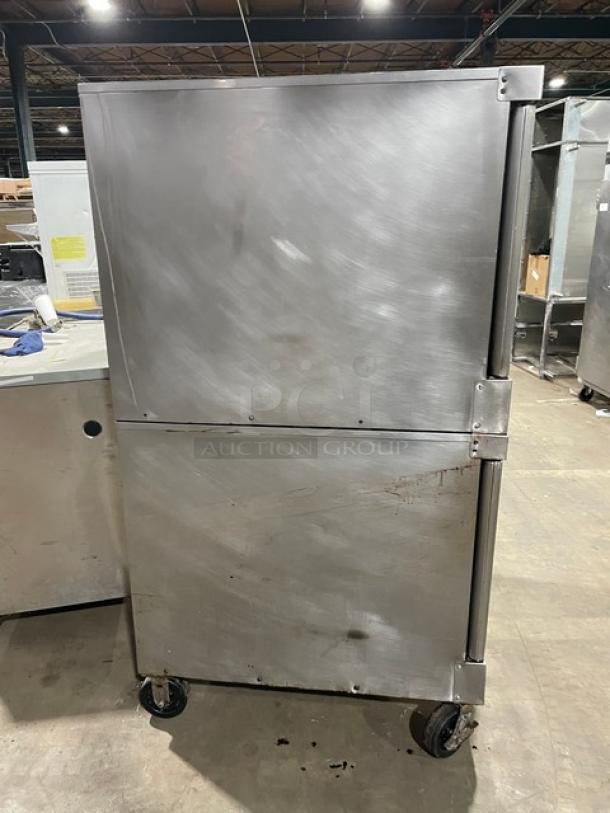 Vulcan SGD4D-1 commercial stainless steel double stacked convection oven on casters, wired rack included, natural gas powered.