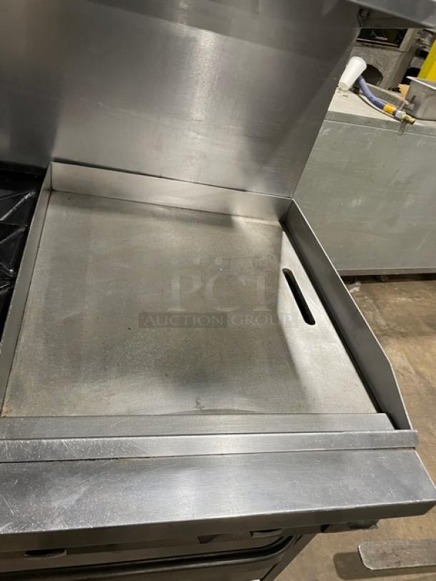 Southbend stainless steel gas range with 6 burners, flat griddle, double oven, non-clog grates, and overhead salamander.