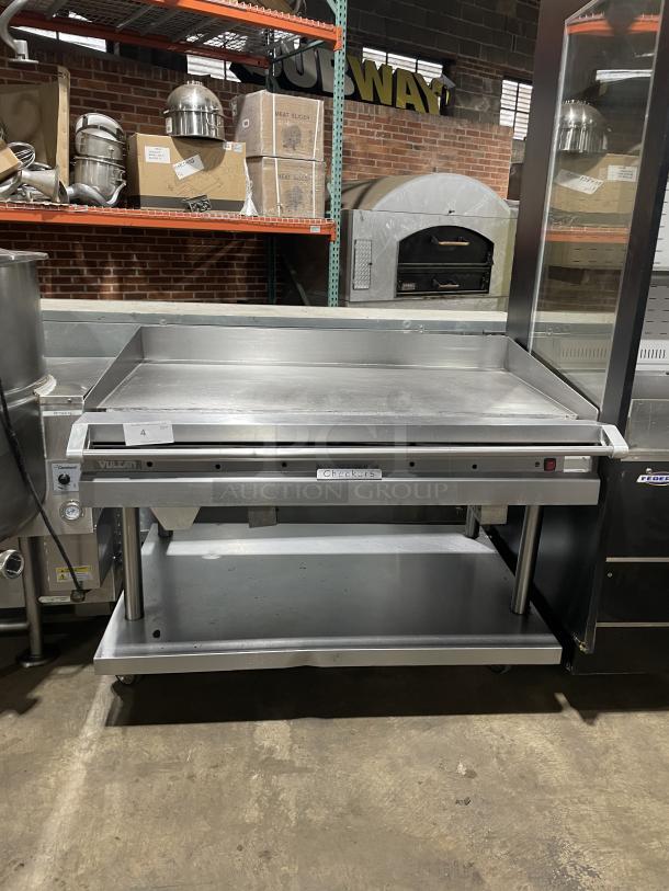 Vulcan stainless steel gas griddle on stand with casters, back and side splash, thermostatic control, 120V 1 phase.