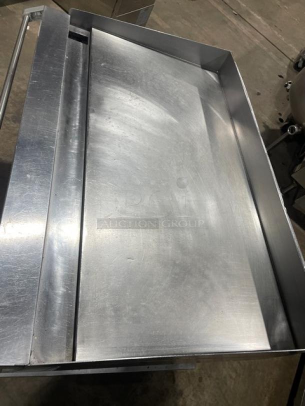 Vulcan stainless steel gas countertop griddle on stand with casters, featuring back & side splash, thermostatic control, 120V 1-phase.