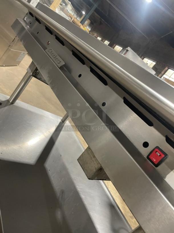 Vulcan commercial stainless steel griddle on stand with casters, featuring back and side splash, thermostatic control.