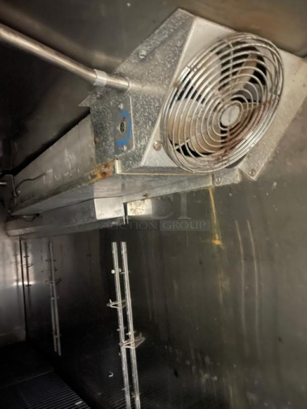 Perlick stainless steel 4-door undercounter refrigerated cabinet interior with fan and coated wire rack. Model: SN: 518921.