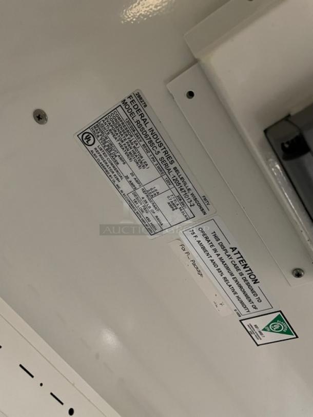 Federal Industries Model RSSD678SC5 sticker and specifications plate on the multi-tier refrigerated display case.