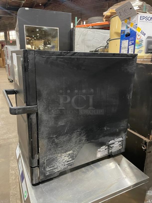 MerryChef Eikon E2S commercial countertop rapid cook oven, black, electric, 208/240V, slight wear, visible labels.