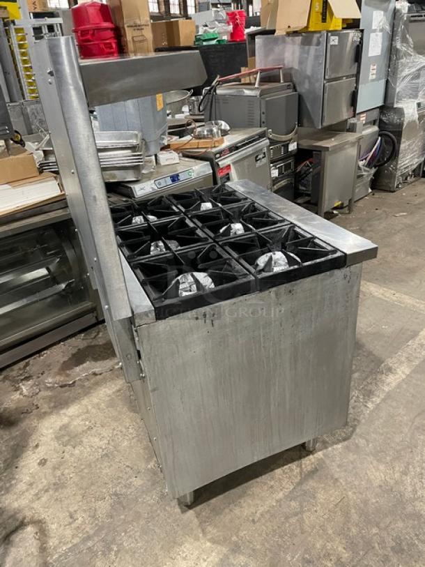 Qualite 6-burner stainless steel range/oven combo, model QLGR36NG. Features backsplash, overhead salamander shelf, wired oven rack.