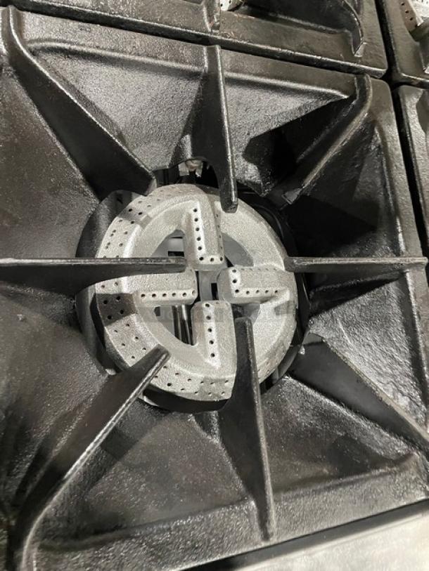 Qualite stainless steel 6-burner gas range/oven, model QLGR-36/NG. Features wired oven rack, backsplash, salamander shelf.