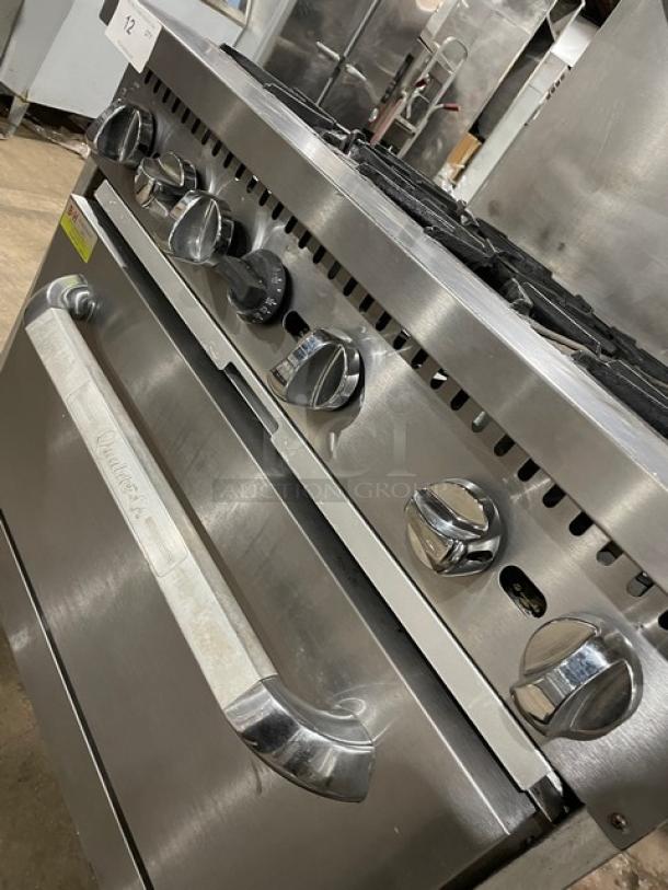 Qualite stainless steel 6-burner range/oven, model QLGR-36/NG, with backsplash, salamander shelf, and wired oven rack.