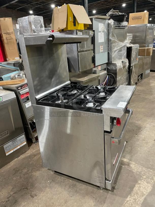 American Range 4-burner gas oven/range combo, stainless steel, with backsplash, salamander shelf, and wired oven rack. On legs.