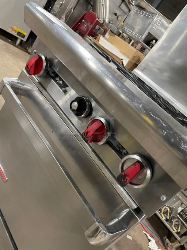 American Range commercial stainless steel 4-burner gas range/oven combo, with backsplash, overhead salamander shelf, and wired oven rack.