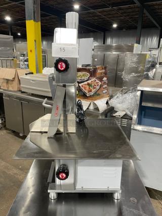 Universal HLS-1650A electric bone saw on legs; commercial-grade polished anodized aluminum, 110V, 1 phase, model SN: 25HL7209-121.